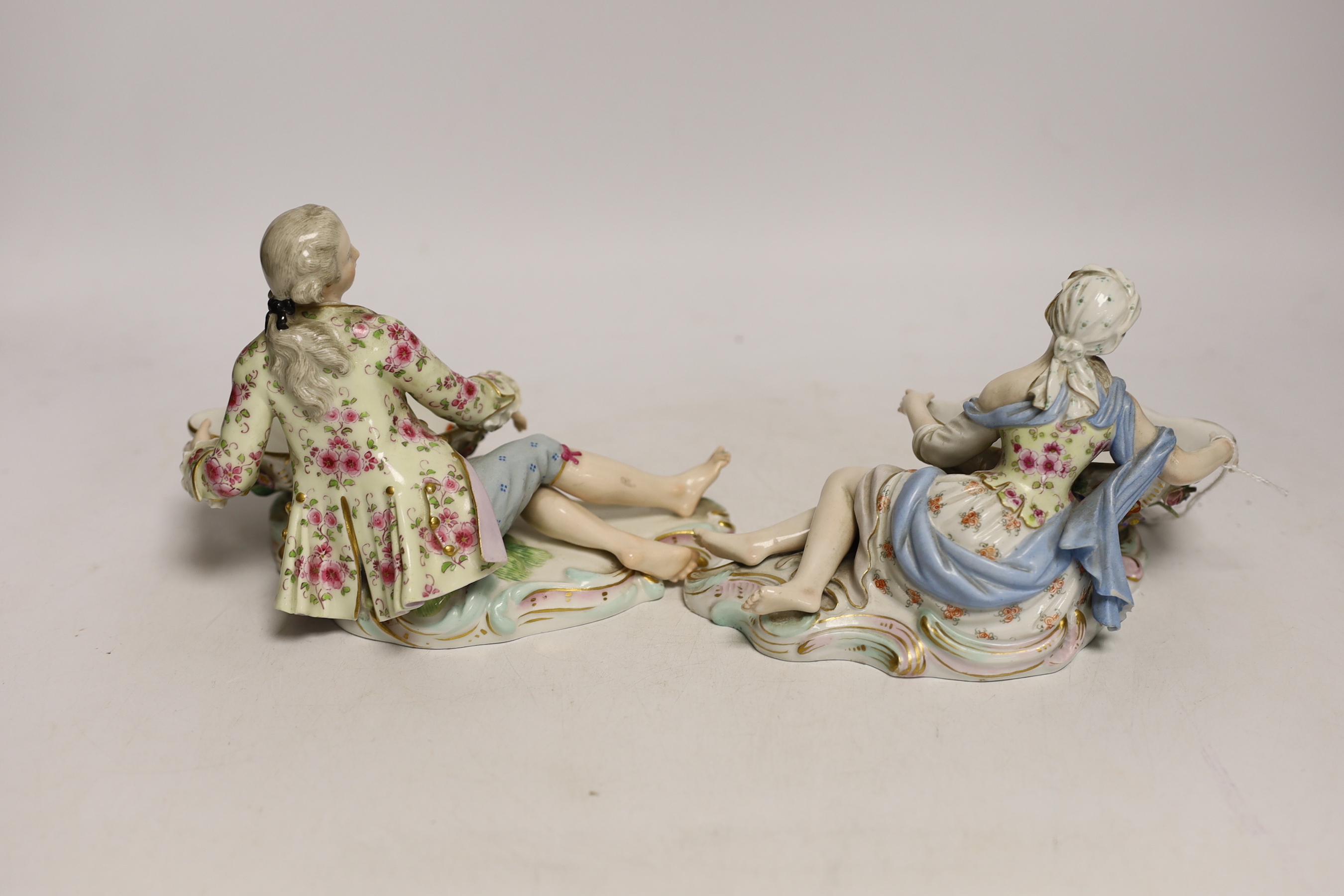 A pair of 19th century Meissen bon-bon figures, incised numbers 2875 and 2872